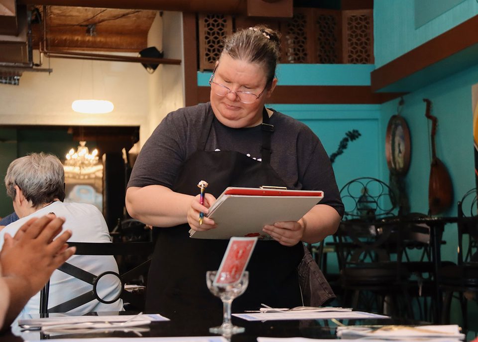 Diana taking orders from guests at powered by pasta